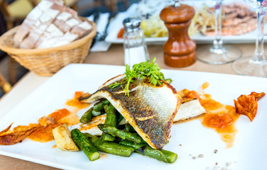 delicious plate of fish and carrot and vegetables