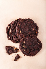 Chocolate cookies with almond on kraft paper background