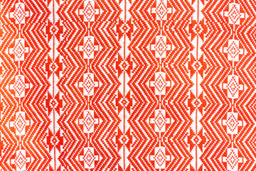 Obraz premium Red pattern on a garment