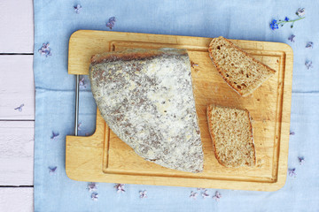 Fresh, home baked soda bread on wooden cutting board, close up