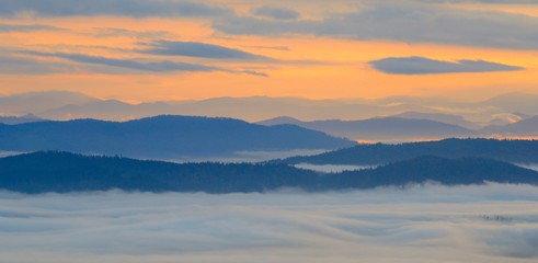 Amazing mountain landscape with dense fog. Carpathian Mountains