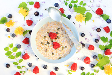 Fresh, morning cereal meal with floral arrangement and fresh fruit