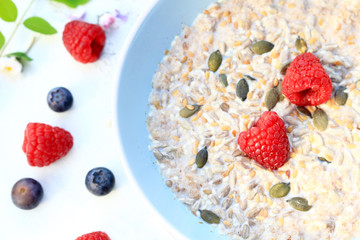 Fresh, morning cereal meal with floral arrangement and fresh fruit