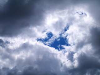 Fototapeta premium the gap in the dark gray clouds