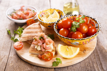 Pita toasts with shrimps and hummus