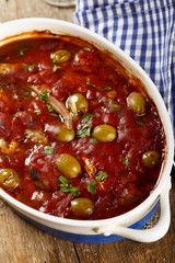 Baked fish with tomatoes and olives
