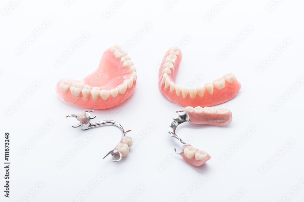 Wall mural set of dentures on white background