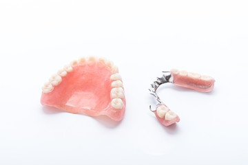 Set of dentures on white background