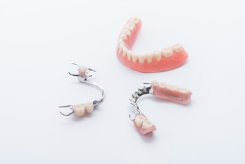 Set of dentures on white background