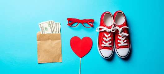 glasses, gumshoes, money and toy