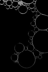 Abstract macro background in black and white of bubbles in water.
