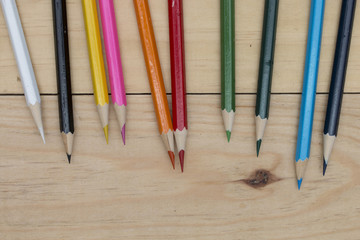 Obraz premium pencils color on wood table.