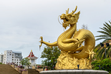 Statue of golden dragon in the Queen Sirikit Public Park in Phuket ,Thailand