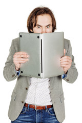 business man hiding behind his laptop computer in his hands. emo