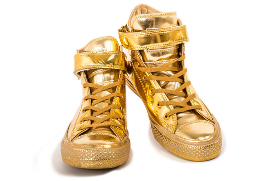 Pair Of Golden Sneakers Isolated