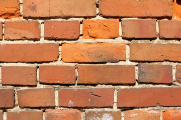 red brick wall/ very old red bricks in the oldness of the masonry of the old house 