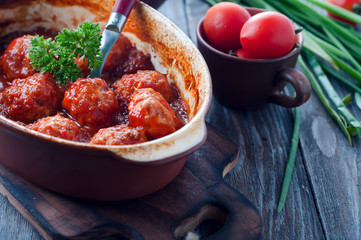 Meatballs in sweet and sour tomato sauce.