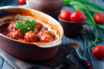 Meatballs in sweet and sour tomato sauce.