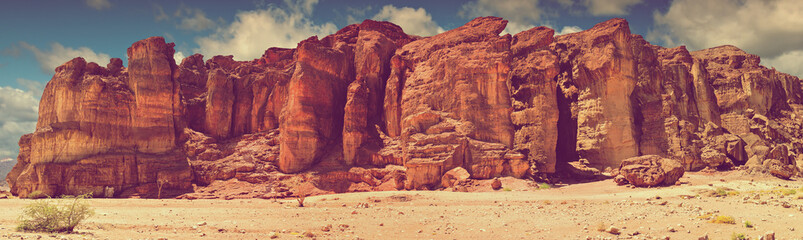 Geological formations (pillars of Solomon) in nature desert valley of Timna park, Israel. Image toned for inspiration of retro style 