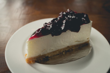 Blueberry cheesecake. Cheesecake with blueberry syrup.(vintage effect)