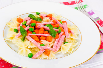 Pasta Bow with Diced Carrots, Salami and Green Peas