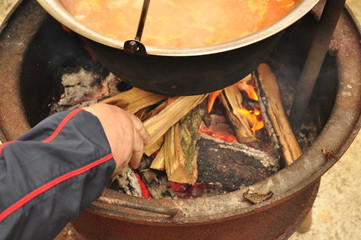 Firewood refill the fire under the goulash