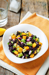 Mango avocado red onion black rice salad