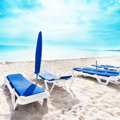 Vacation holidays background wallpaper with beach lounge chairs