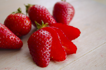 Ripe fresh strawberries on a wooden background. Red berries on a table