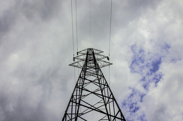 Pylon and transmission power line in cloudy day
