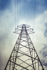 Pylon and transmission power line in cloudy day