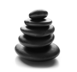 Stack of spa hot stones isolated on white