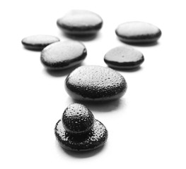 Heap of spa hot stones isolated on white