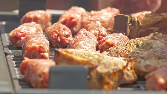 Traditional Romanian Barbecue With Pork Meat Rolls (Mici Or Mititei) And Stakes