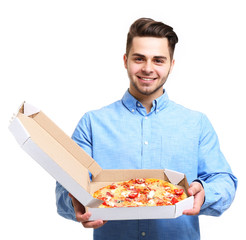 Young handsome man and pizza isolated on white
