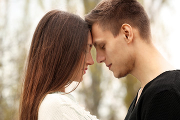 Naklejka premium Young couple going to kiss