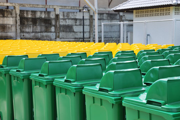 Recycle bins in a group made of commercial size yellow and green - 111893226