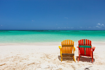 Colorful adirondack lounge chairs at Caribbean beach