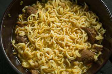 Asian quick noodles on wood background photo