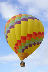 Hot air balloon floating over Temecula wine vineyards