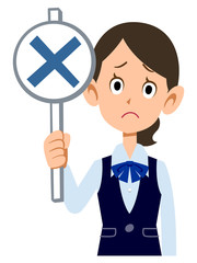 制服着用の女性会社員が不正解の札を見せる
