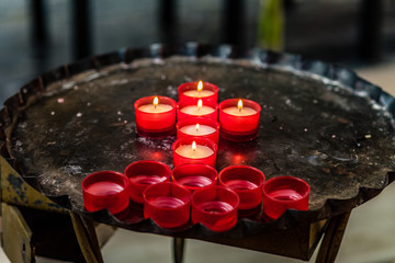 Cross of votive candles