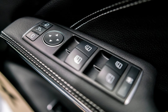 luxury car control buttons - door panel ; Interior details.
