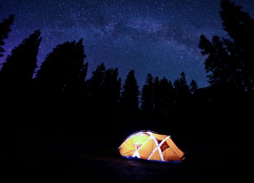 Orange Tent under Milky Way at Night. Crater Lake National Park, Oregon, USA. 