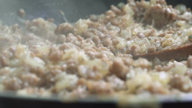 Frying Minced Meat On A Teflon Pan With Chopped Onion And Rice
