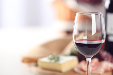 Glass of wine with food on table closeup