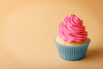 Birthday cupcake on color background