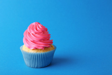 Birthday cupcake on blue background