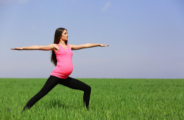Pregnant woman practicing yoga pose