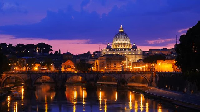 saint peter basilica illuminated at night reflection on tiber river vatican city rome italy